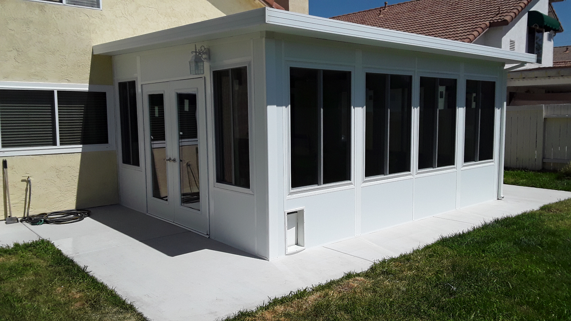 White Sunroom with French Doors