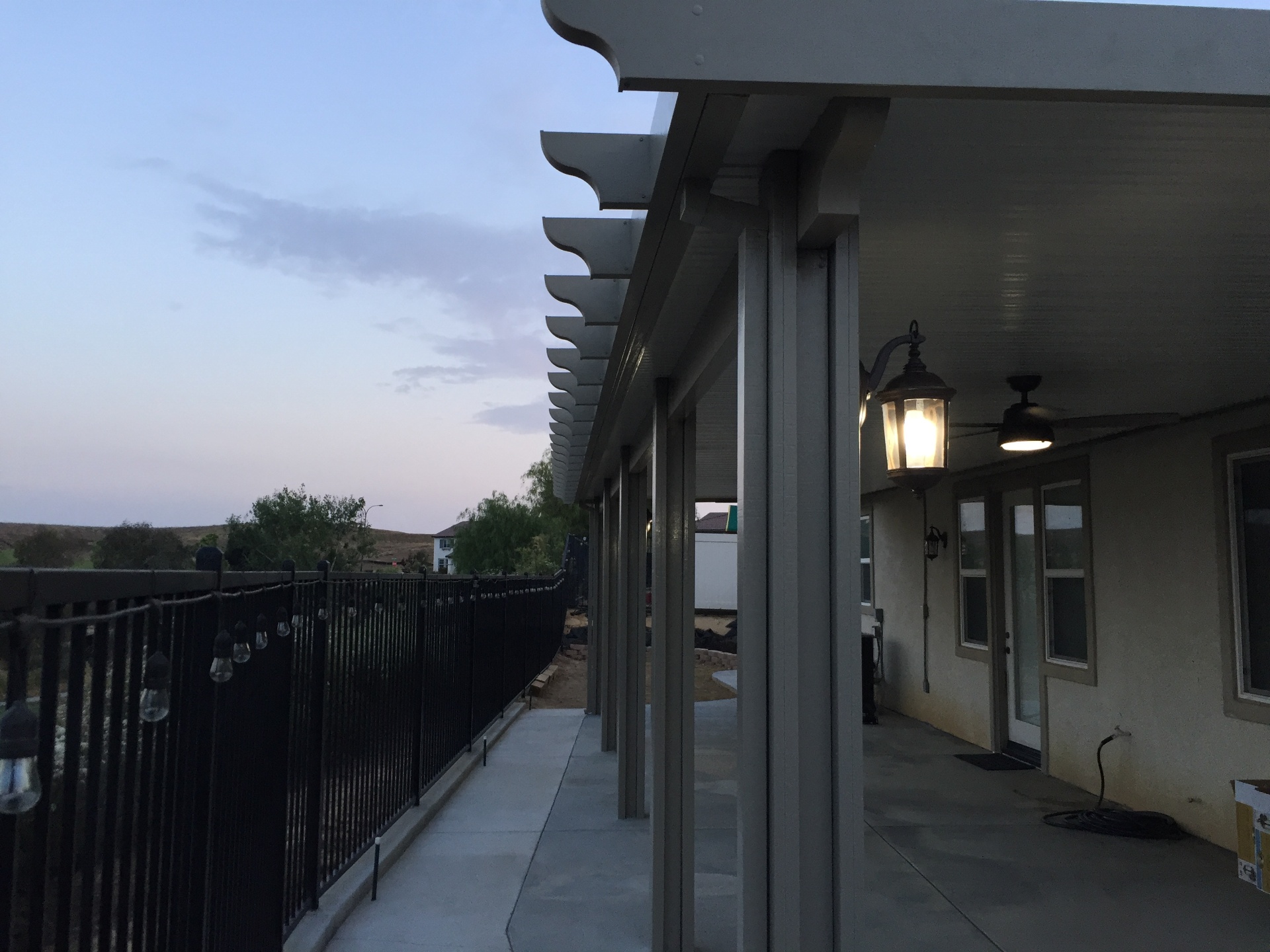 Daytime view of an aluminum patio cover installation on a Southern California home